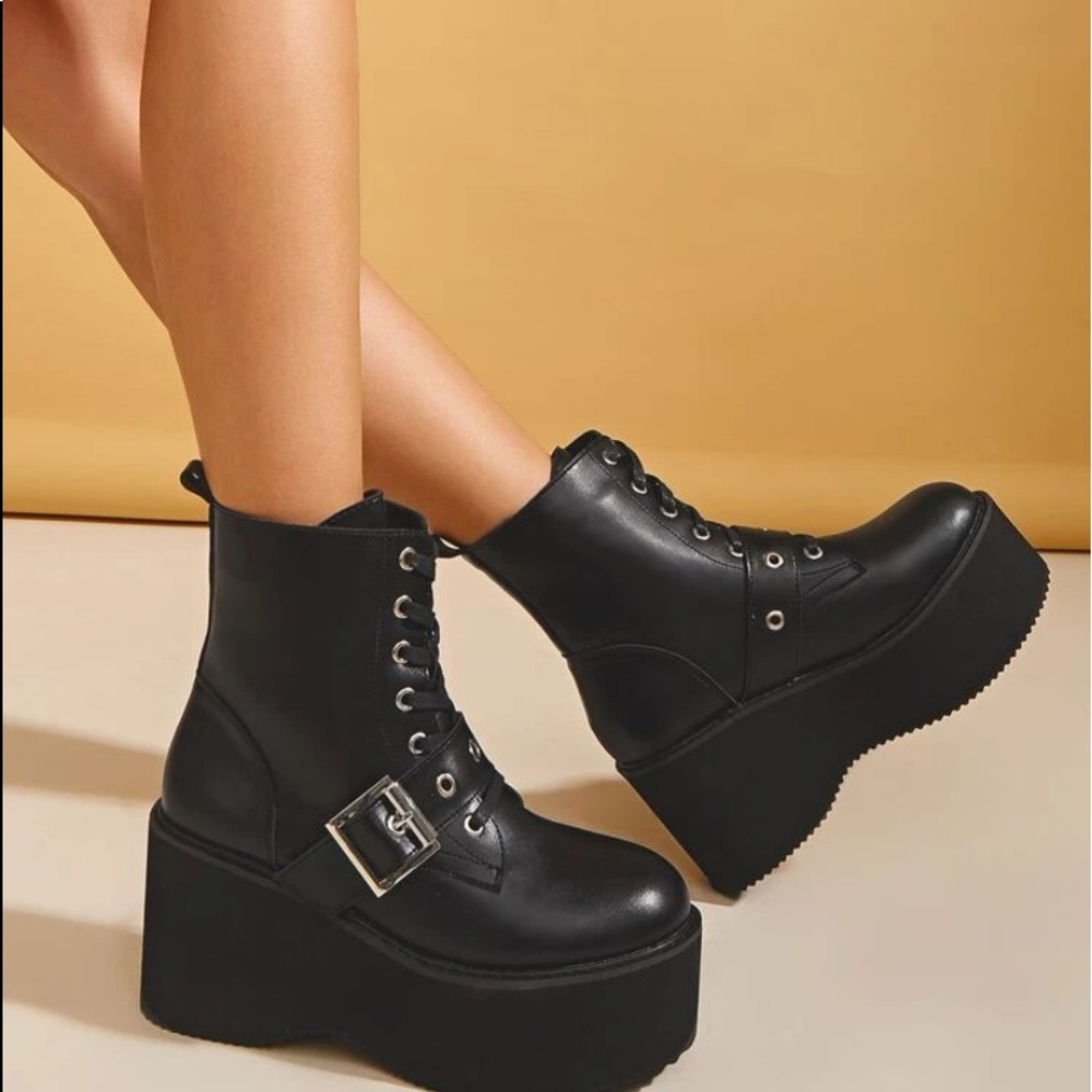 Black platform boots with buckle